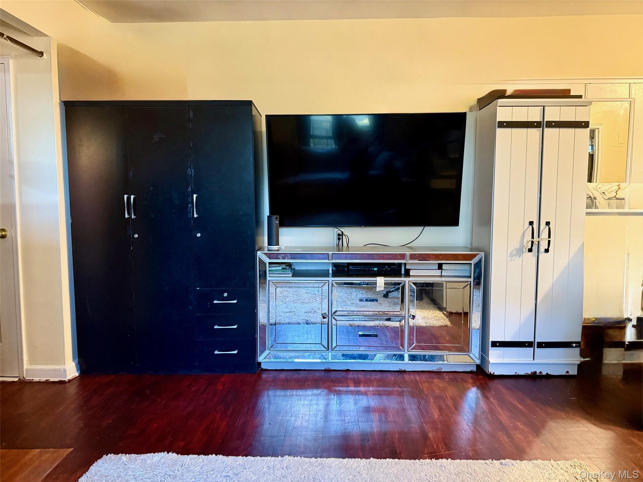 112-25 34th Avenue, Unit 3E Queens, NY 11368 - Photo 5 of 33 a living room with furniture and a flat screen tv