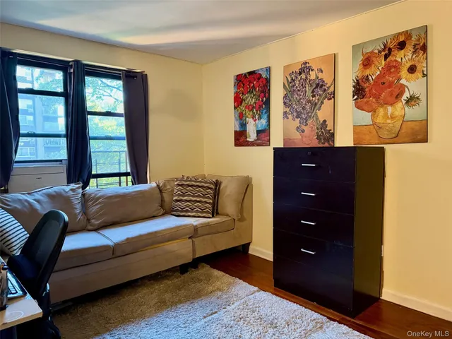 a living room with furniture and a window