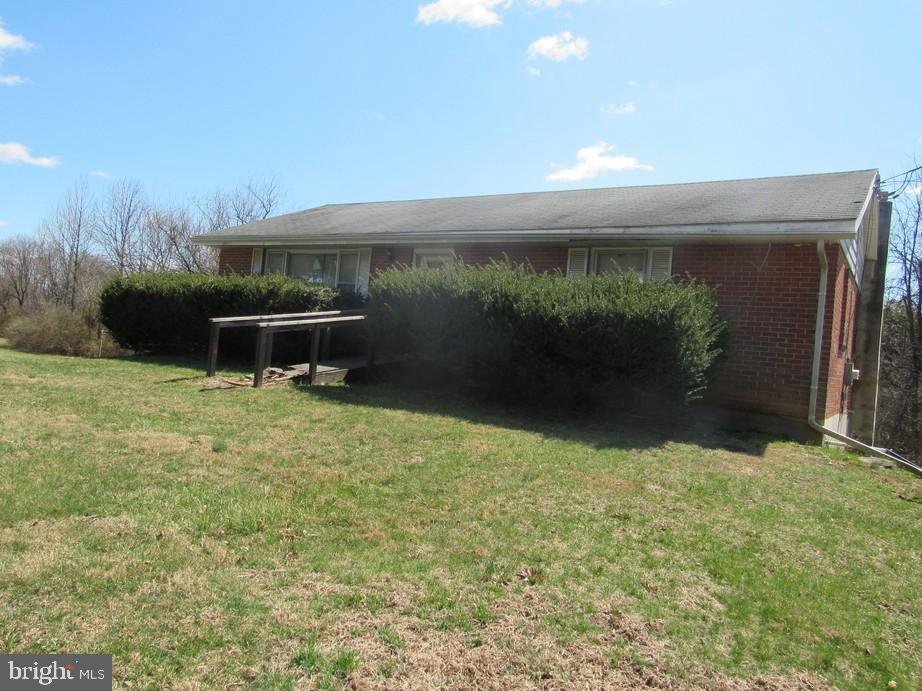1148 Holtwood Road Holtwood, PA 17532 - Photo 1 of 2 a view of a back yard from a bench