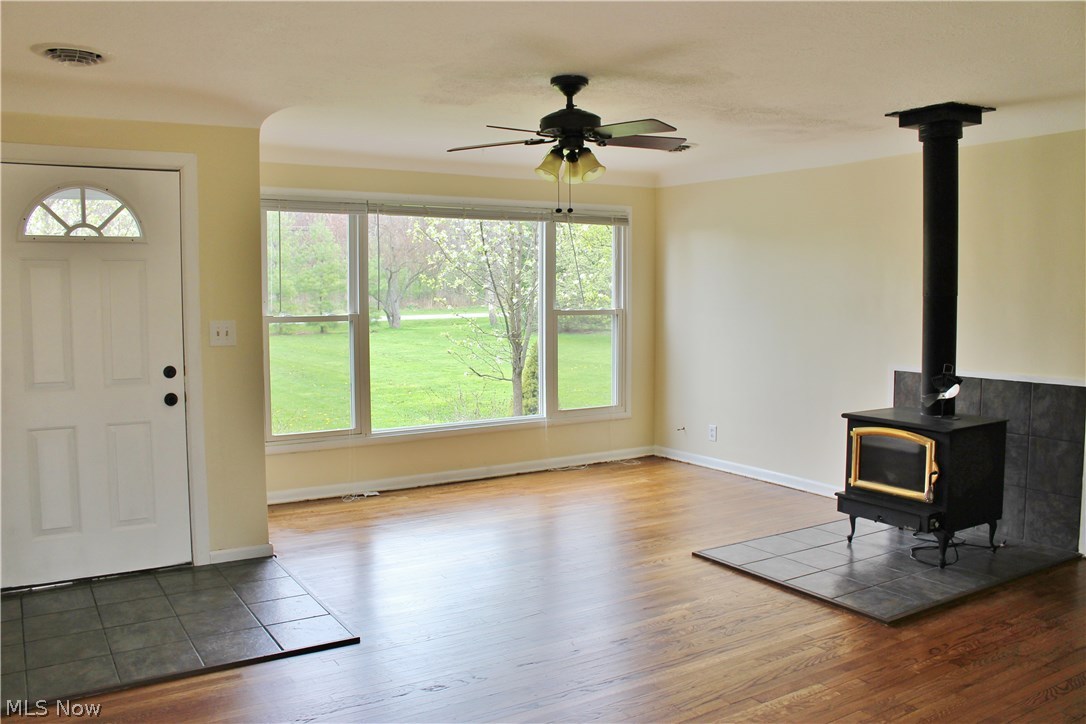 10702 Chillicothe Road Kirtland, OH 44094 - Photo 7 of 25 Spacious Living Room with recently finished hardwood floors. Great views as seen through the picture window. Newer front door and tile.