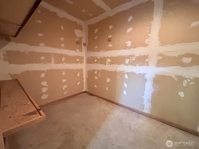 a view of empty room with wooden ceiling