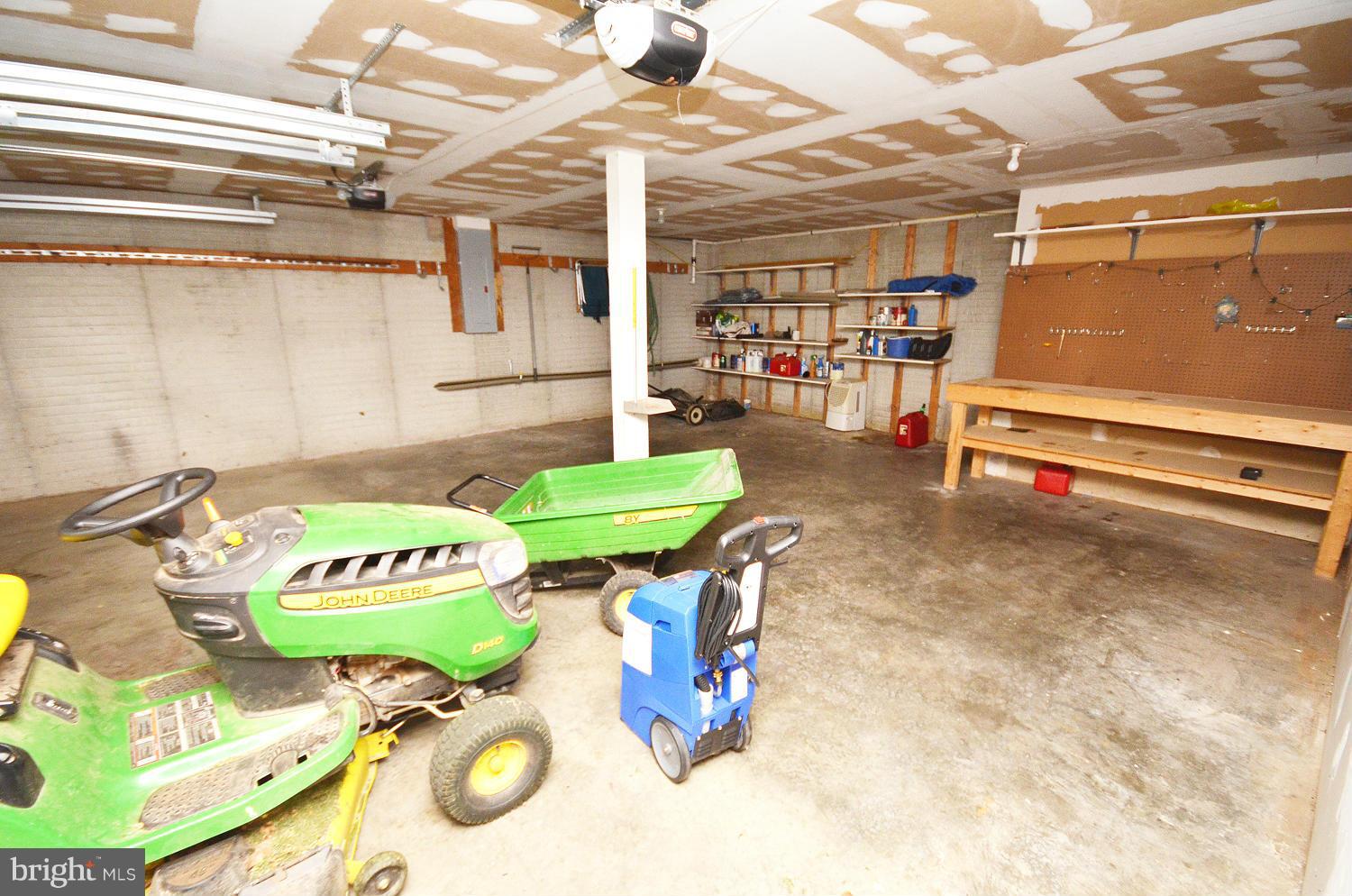 228 North Hayfield Road Winchester, VA 22603 - Photo 17 of 20 Garage w/Lawn Tractor