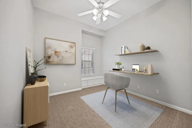 a view of workspace with furniture and wooden floor