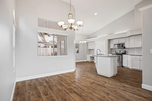 a view of a kitchen with stove and cabinets