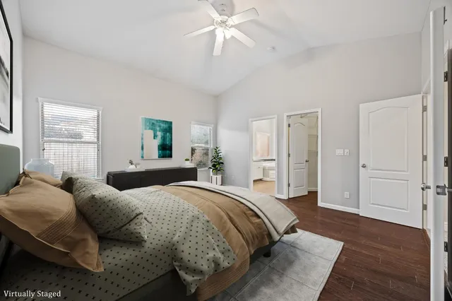 a spacious bedroom with a bed and window