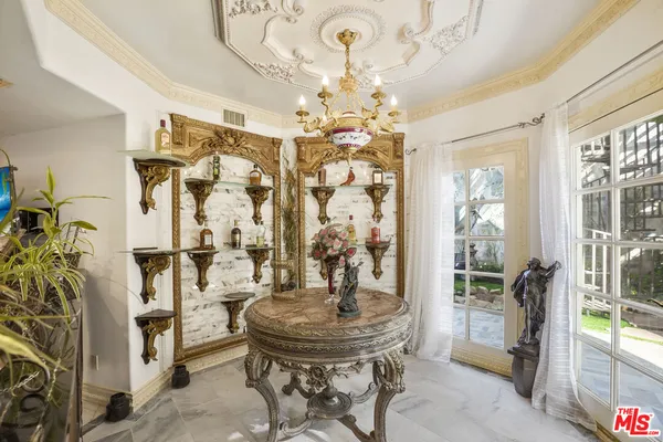 a view of empty room with wooden floor and entryway
