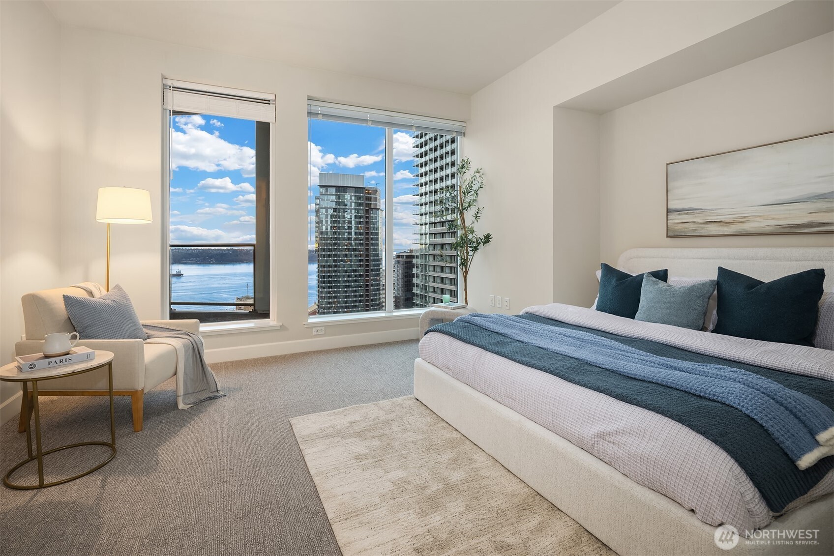 1920 4th Avenue, Unit 2702 Seattle, WA 98101 - Photo 16 of 40 a bedroom with bed and large windows