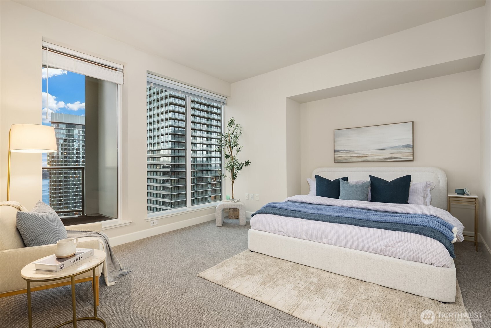 1920 4th Avenue, Unit 2702 Seattle, WA 98101 - Photo 18 of 40 a bedroom with a bed and a large window