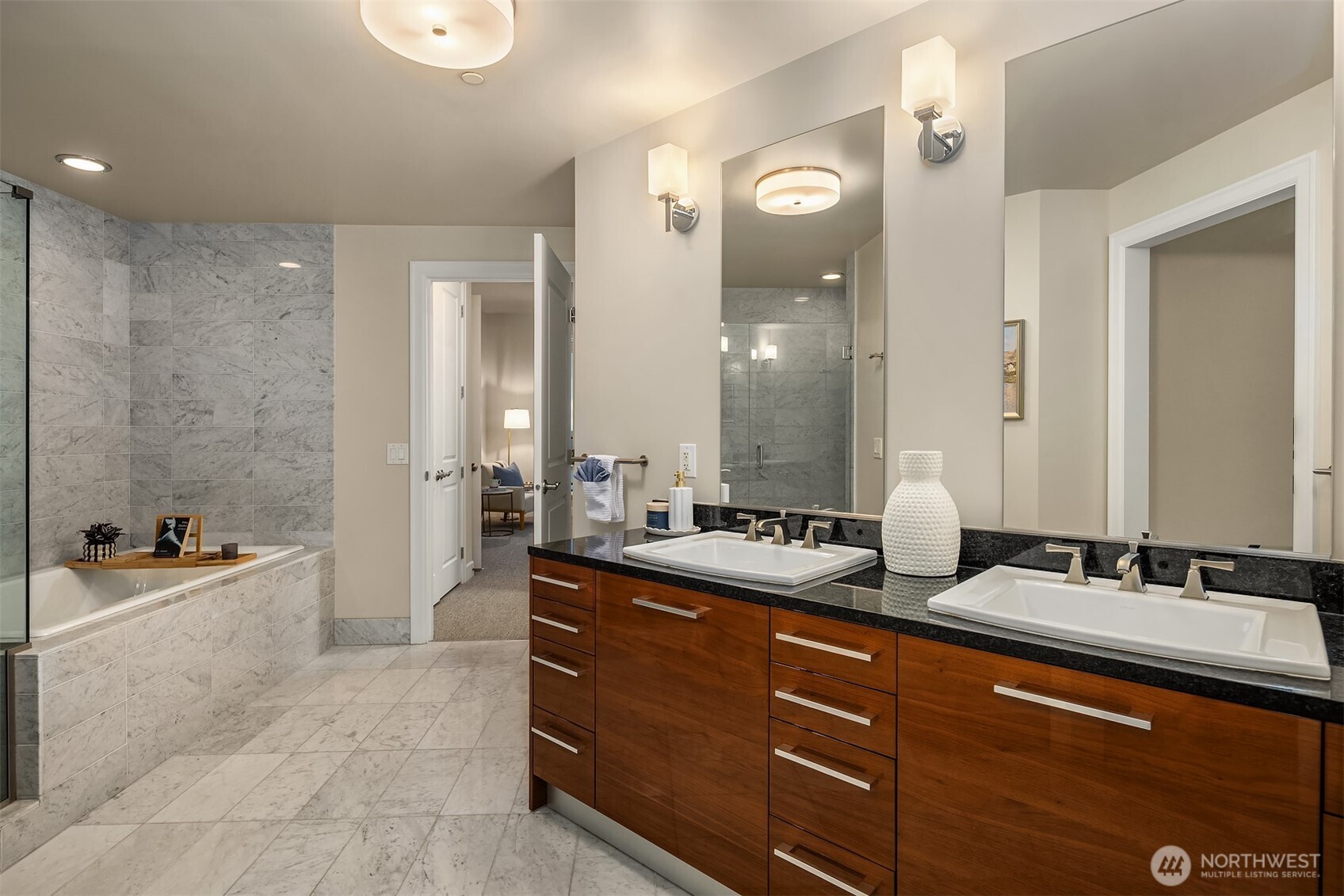 1920 4th Avenue, Unit 2702 Seattle, WA 98101 - Photo 20 of 40 a spacious bathroom with a tub double sink and mirror