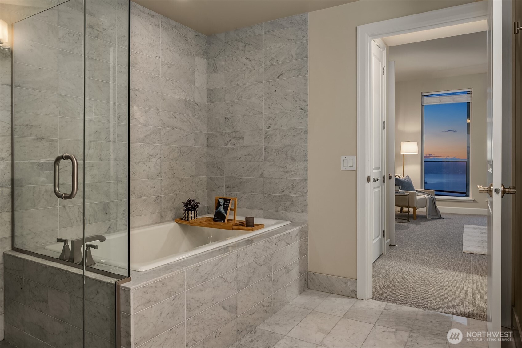 1920 4th Avenue, Unit 2702 Seattle, WA 98101 - Photo 21 of 40 a bathroom with a sink and tub