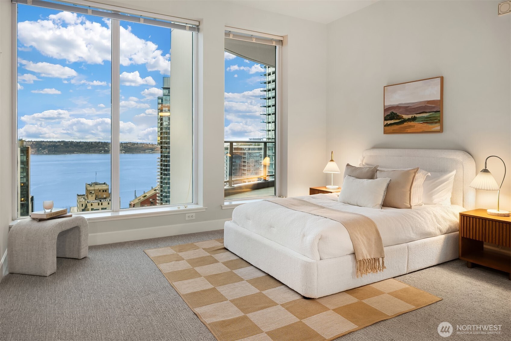 1920 4th Avenue, Unit 2702 Seattle, WA 98101 - Photo 23 of 40 a bedroom with a bed and a large window
