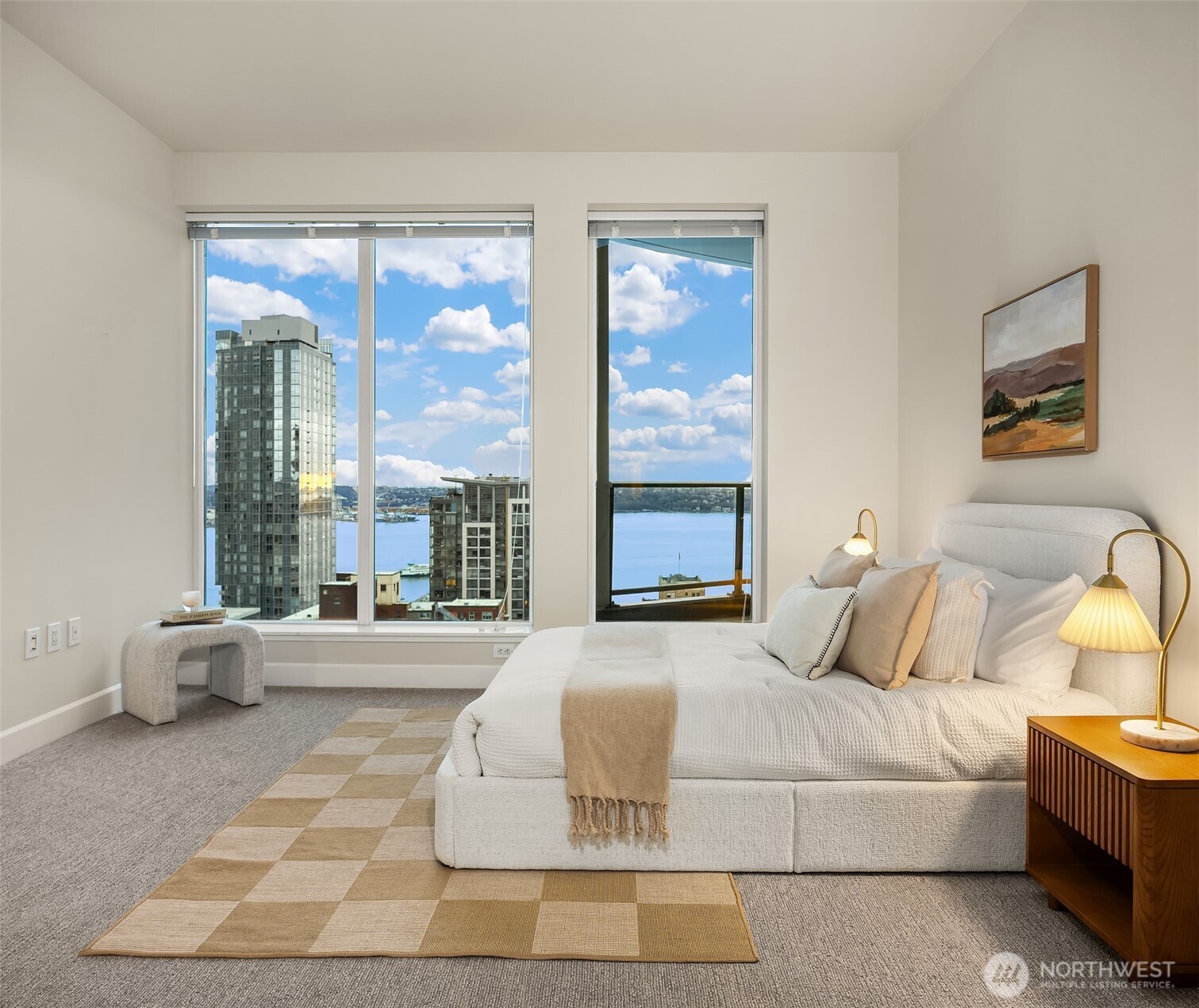 1920 4th Avenue, Unit 2702 Seattle, WA 98101 - Photo 24 of 40 a bedroom with a large bed and a large window