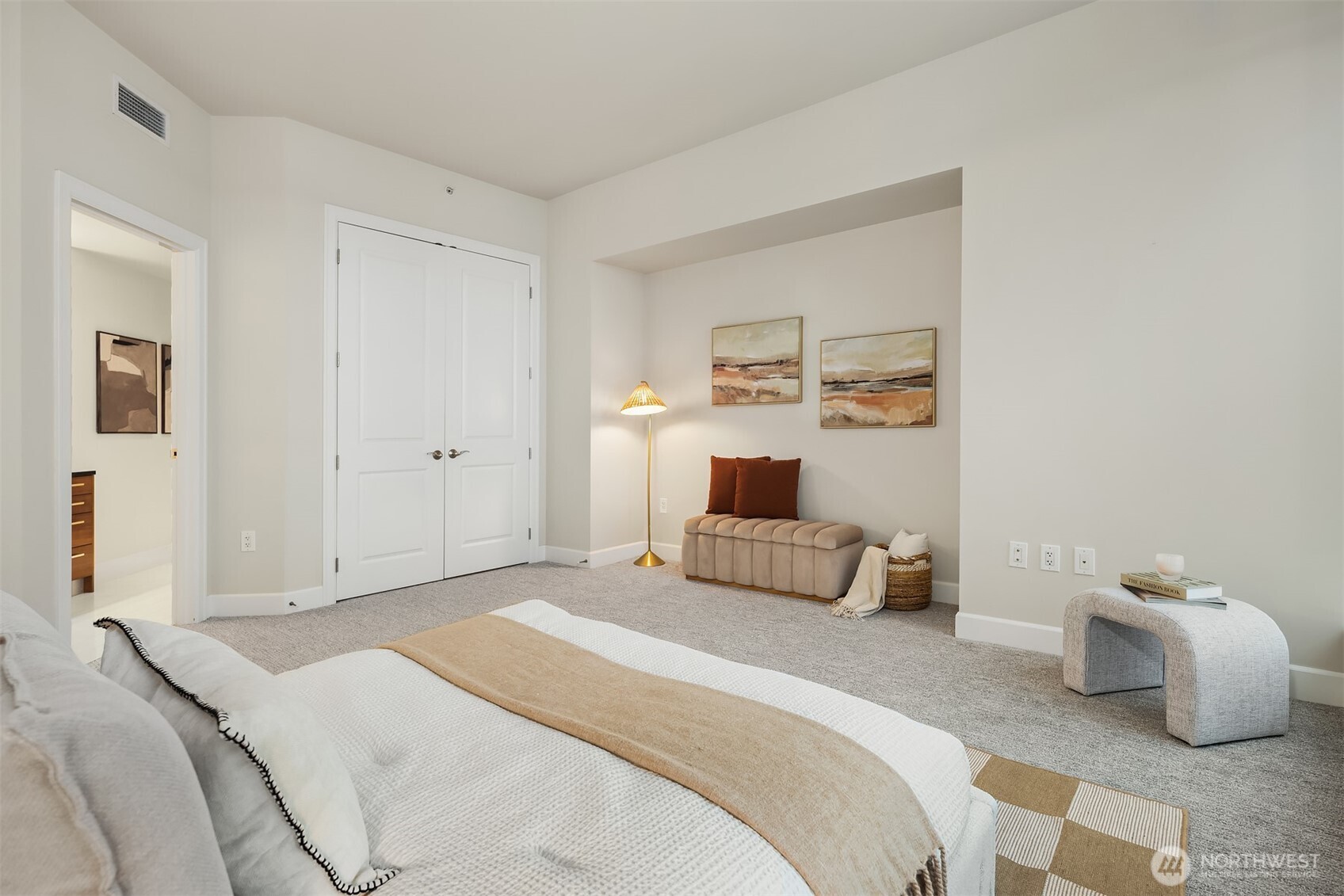1920 4th Avenue, Unit 2702 Seattle, WA 98101 - Photo 25 of 40 a bedroom with a bed and a couch