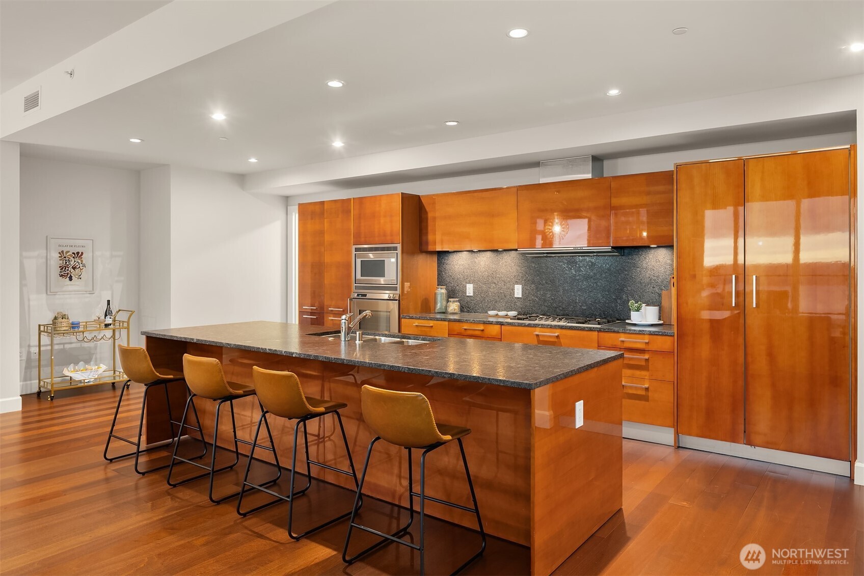 1920 4th Avenue, Unit 2702 Seattle, WA 98101 - Photo 6 of 40 a dining hall with stainless steel appliances a table and chairs