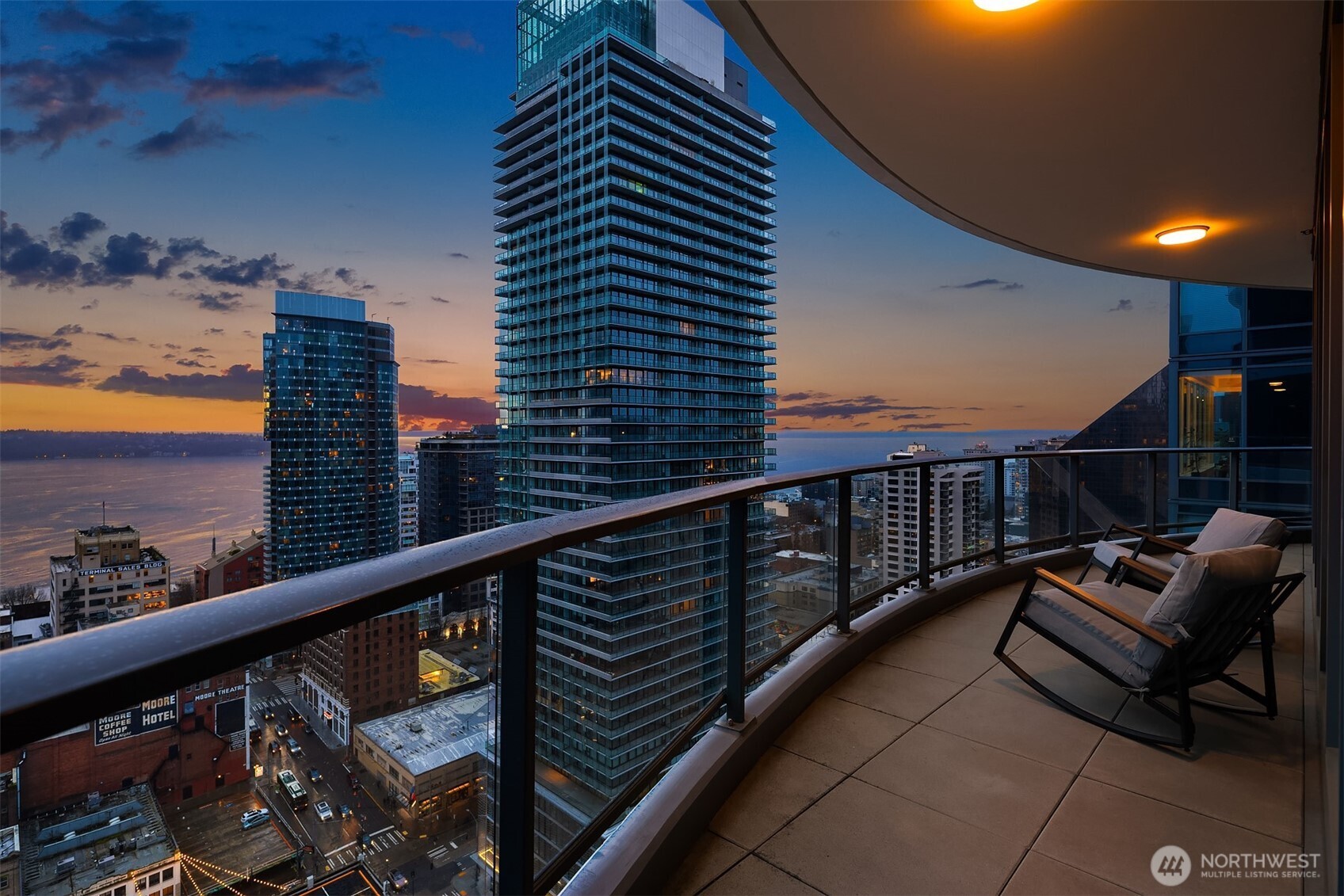 1920 4th Avenue, Unit 2702 Seattle, WA 98101 - Photo 10 of 40 a balcony with wooden floor view and city view