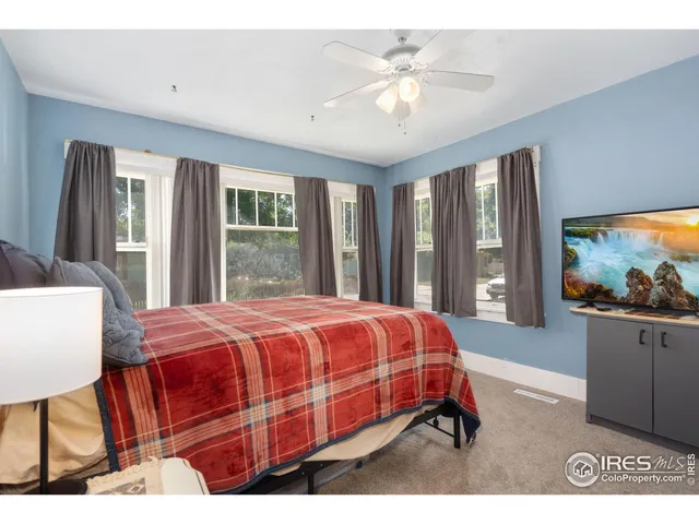 a living room with furniture and a lamp