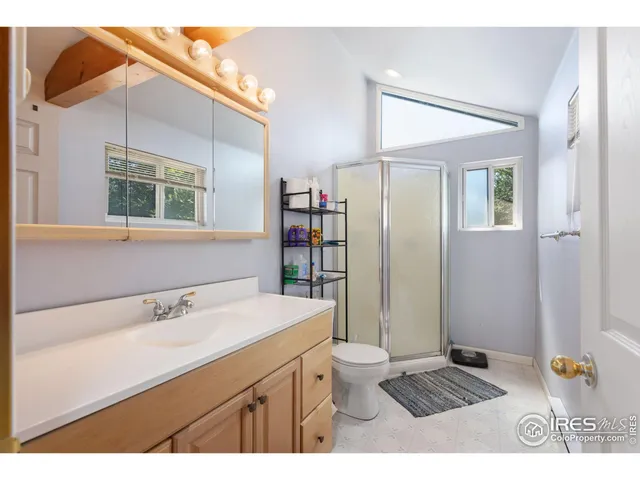 a view of a patio with table and chairs and potted plants