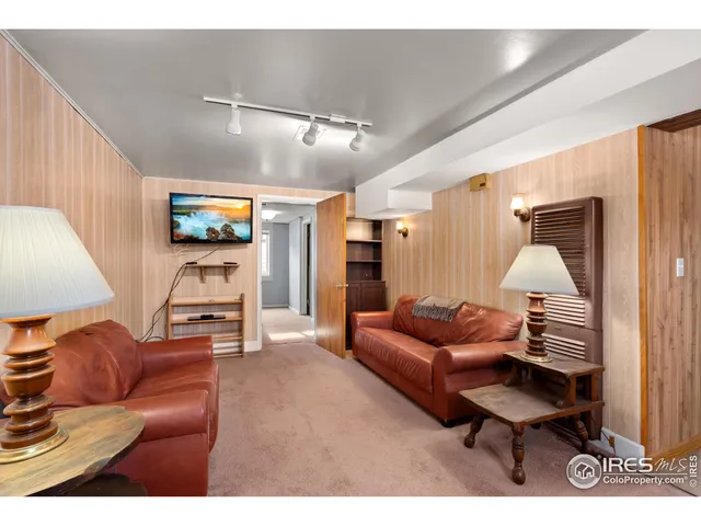 a view of a patio with table and chairs and potted plants