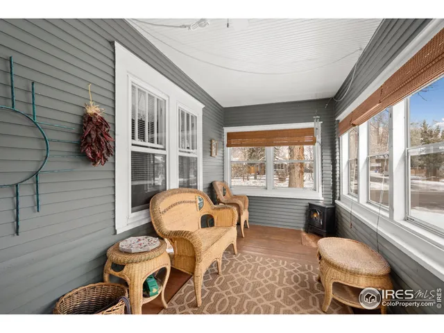 a backyard of a house with yard and outdoor seating