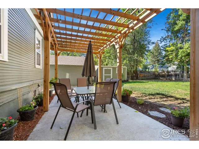 a view of a park with large trees
