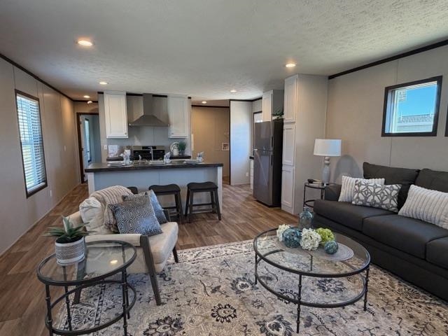 200 West 20th Street, Unit A138 Rifle, CO 81650 - Photo 4 of 7 a living room with furniture and a kitchen