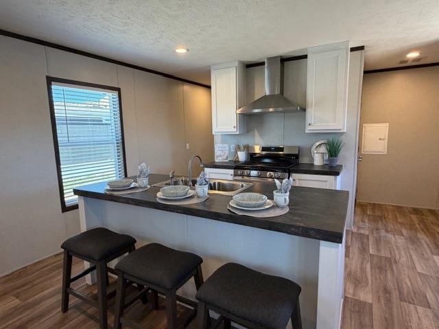 200 West 20th Street, Unit A138 Rifle, CO 81650 - Photo 5 of 7 a kitchen with stainless steel appliances granite countertop a sink a stove a table and chairs