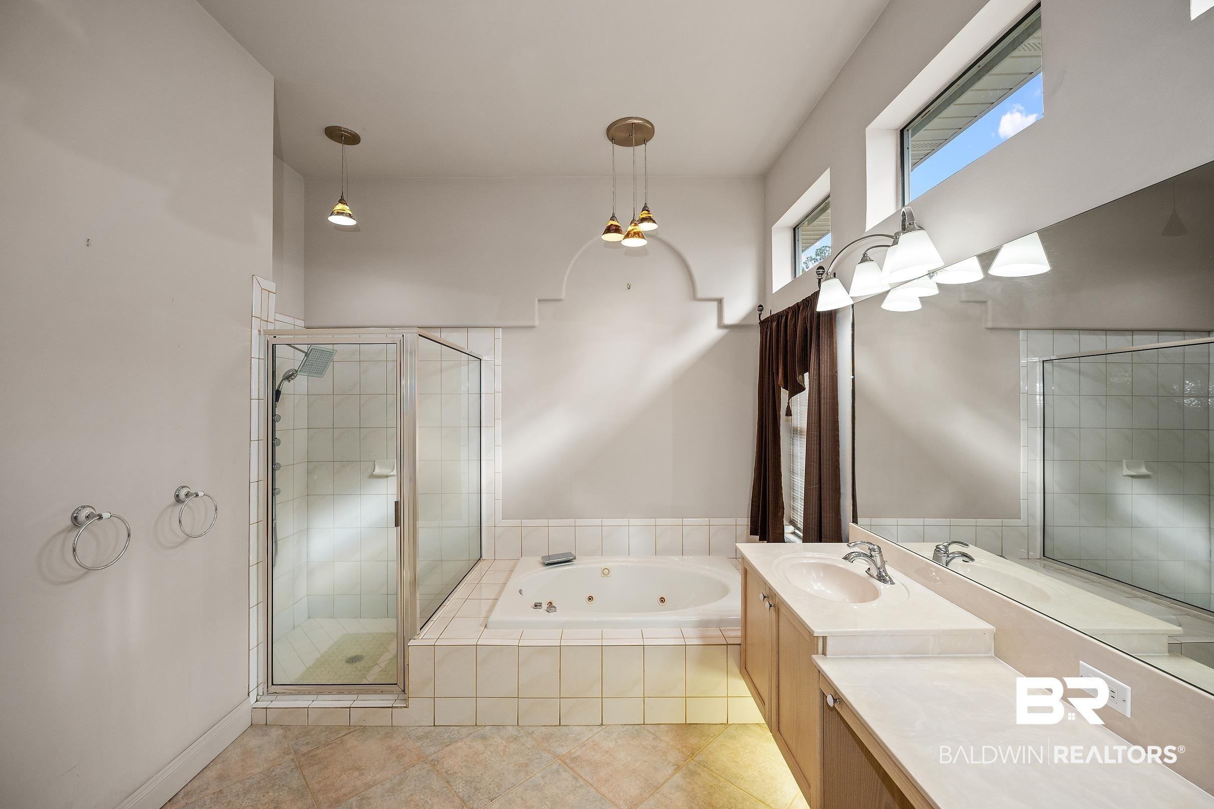 8591 Bay Harbor Road Elberta, AL 36530 - Photo 33 of 56 Full bathroom featuring vanity, a jetted tub, a shower stall, and light tile patterned flooring