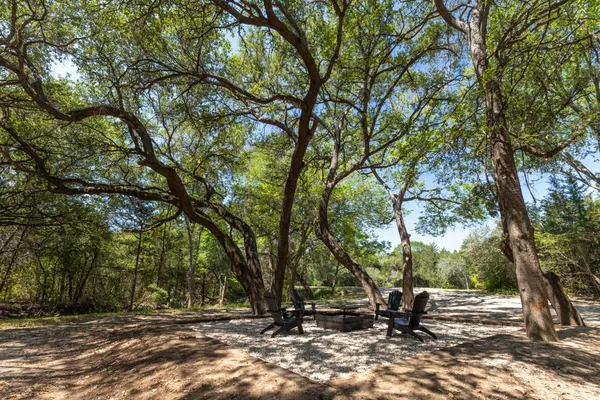 a view of outdoor space with deck and trees