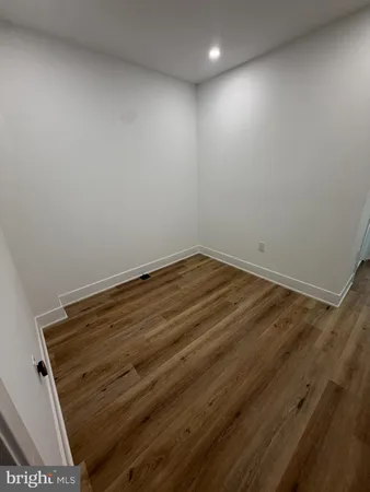 a hallway with a washer and dryer