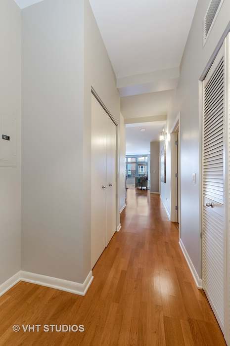 1200 West Monroe Street, Unit 502 Chicago, IL 60607 - Photo 4 of 20 a view of a hallway with wooden floor