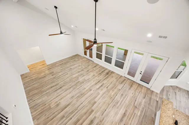 a view of a room with a wooden floor
