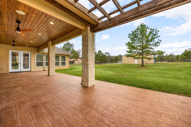 a view of a big yard with large trees and a big yard