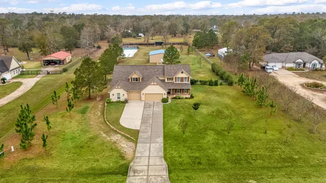 swimming pool view with a balcony