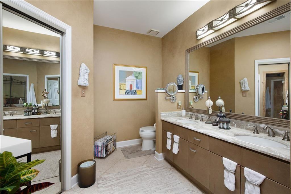 5264 Brooke Ridge Drive Dunwoody, GA 30338 - Photo 18 of 34 a bathroom with a granite countertop sink mirror and toilet