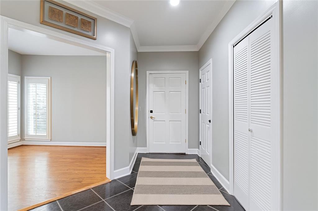 5264 Brooke Ridge Drive Dunwoody, GA 30338 - Photo 2 of 34 a view of a hallway with wooden floor and a large window