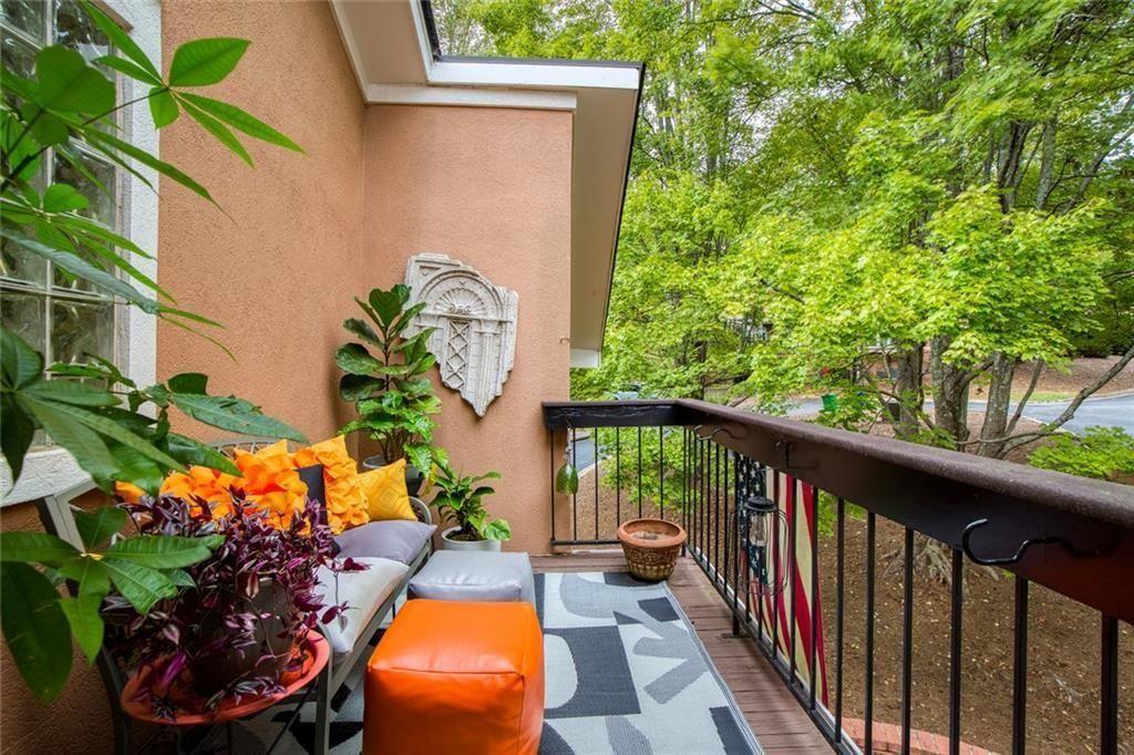 5264 Brooke Ridge Drive Dunwoody, GA 30338 - Photo 23 of 34 a balcony with wooden floor and flowers