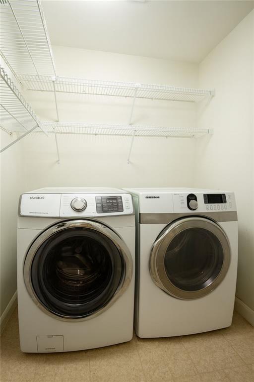 5264 Brooke Ridge Drive Dunwoody, GA 30338 - Photo 24 of 34 a utility room with dryer and washer
