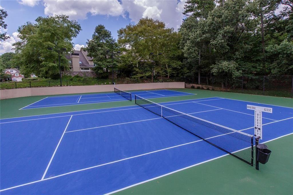 5264 Brooke Ridge Drive Dunwoody, GA 30338 - Photo 30 of 34 a view of an outdoor space and tennis court