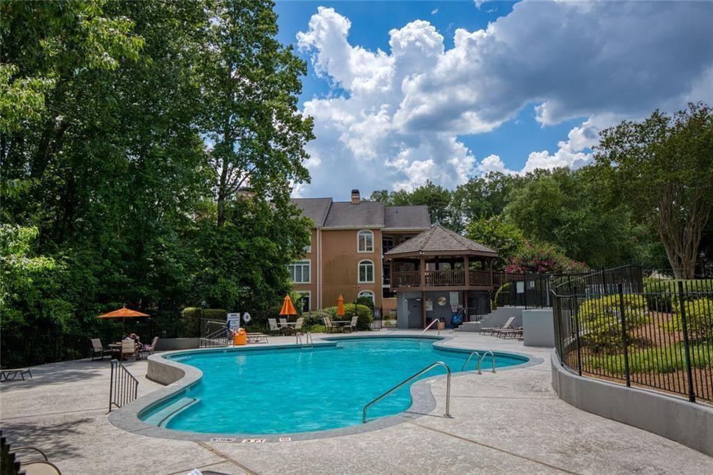 5264 Brooke Ridge Drive Dunwoody, GA 30338 - Photo 31 of 34 a front view of a house with garden