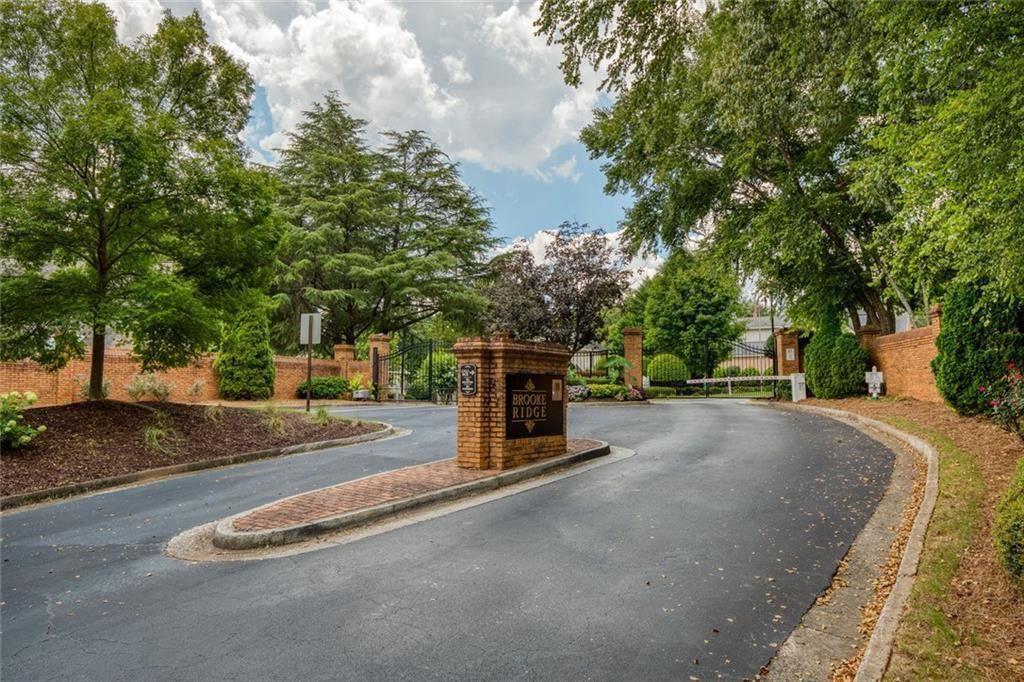 5264 Brooke Ridge Drive Dunwoody, GA 30338 - Photo 32 of 34 a view of a house with large tree and plants