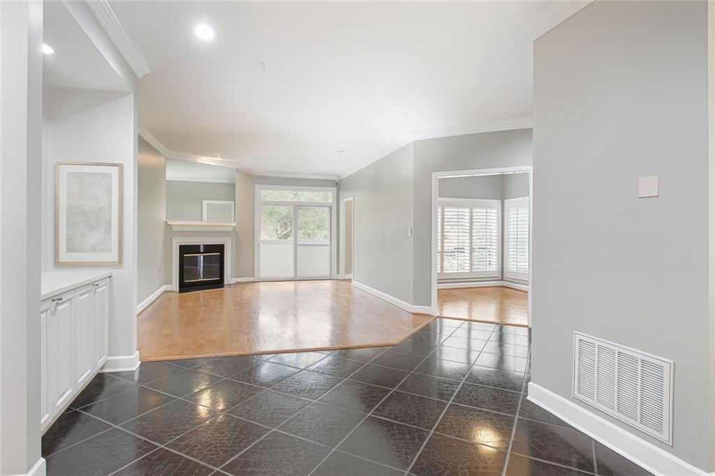 5264 Brooke Ridge Drive Dunwoody, GA 30338 - Photo 4 of 34 a view of empty room with wooden floor and fireplace