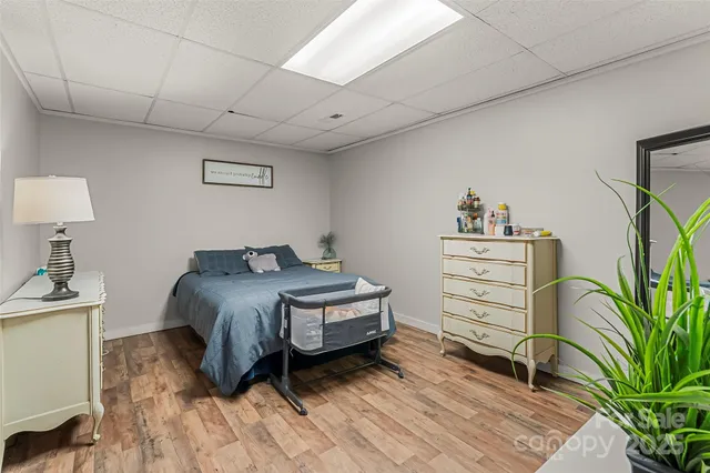 a bedroom with a bed and a desk