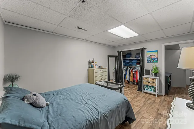 a bedroom with a bed and a closet