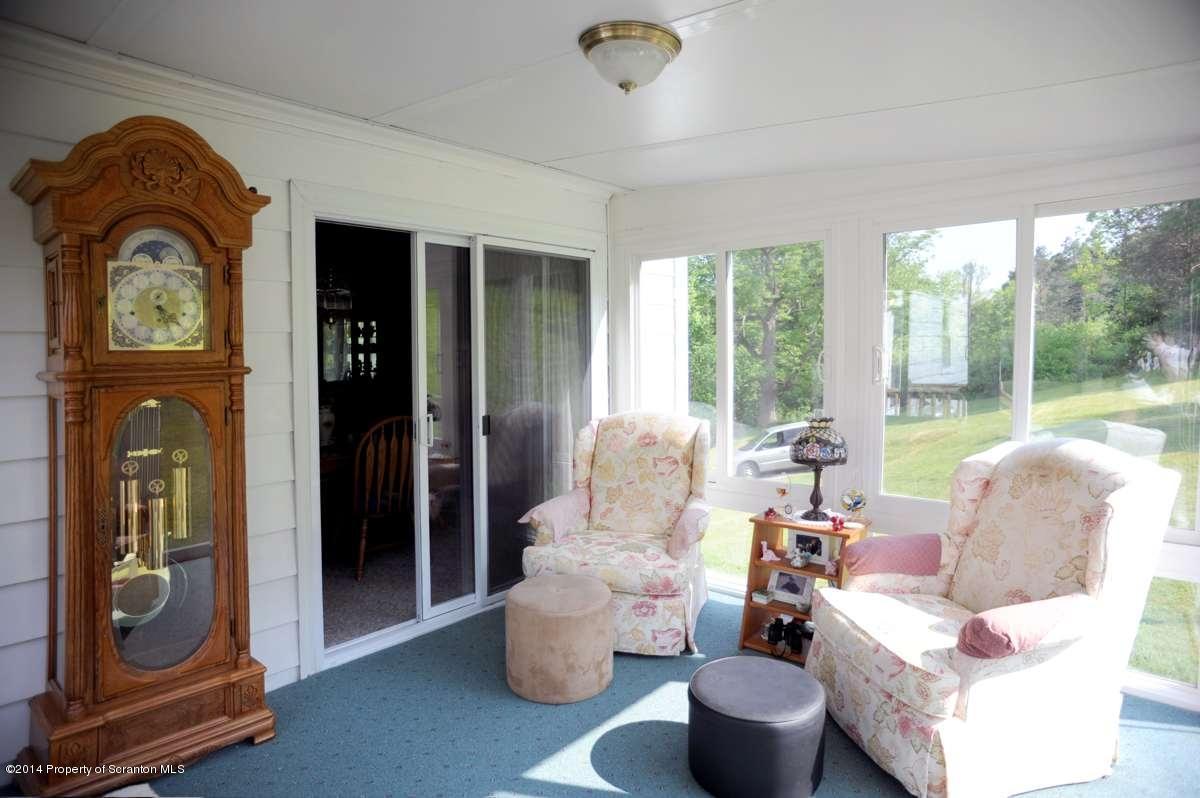365 State Rte 2035 Nicholson, PA 18446 - Photo 12 of 28 a living room with furniture and a large window