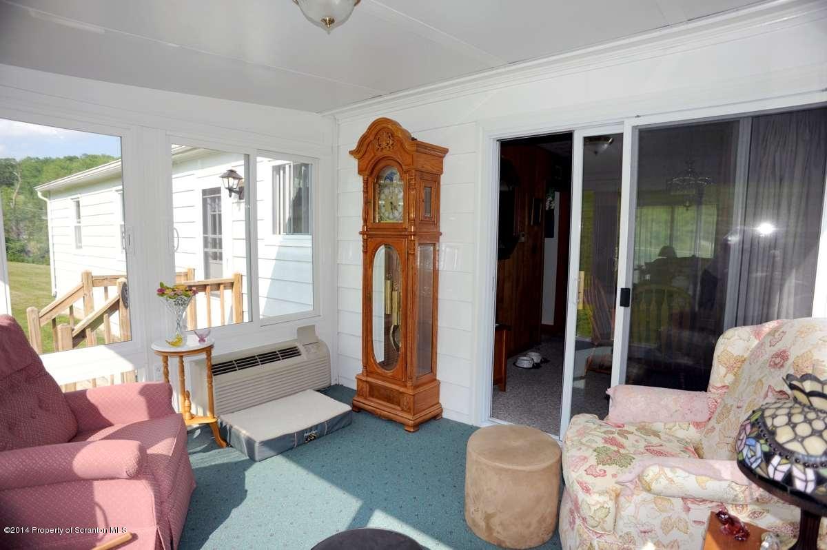 365 State Rte 2035 Nicholson, PA 18446 - Photo 14 of 28 a bedroom with furniture and a window