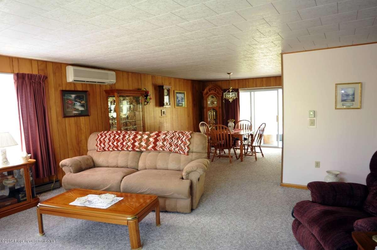365 State Rte 2035 Nicholson, PA 18446 - Photo 16 of 28 a living room with furniture and a couch