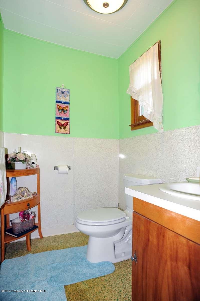 365 State Rte 2035 Nicholson, PA 18446 - Photo 18 of 28 a bathroom with a toilet and a sink