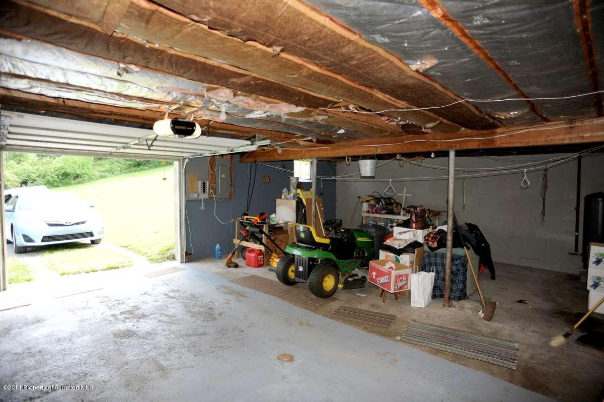 365 State Rte 2035 Nicholson, PA 18446 - Photo 24 of 28 a view of a garage with a bike and car