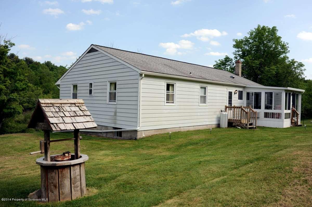 365 State Rte 2035 Nicholson, PA 18446 - Photo 25 of 28 a backyard of a house with table and chairs