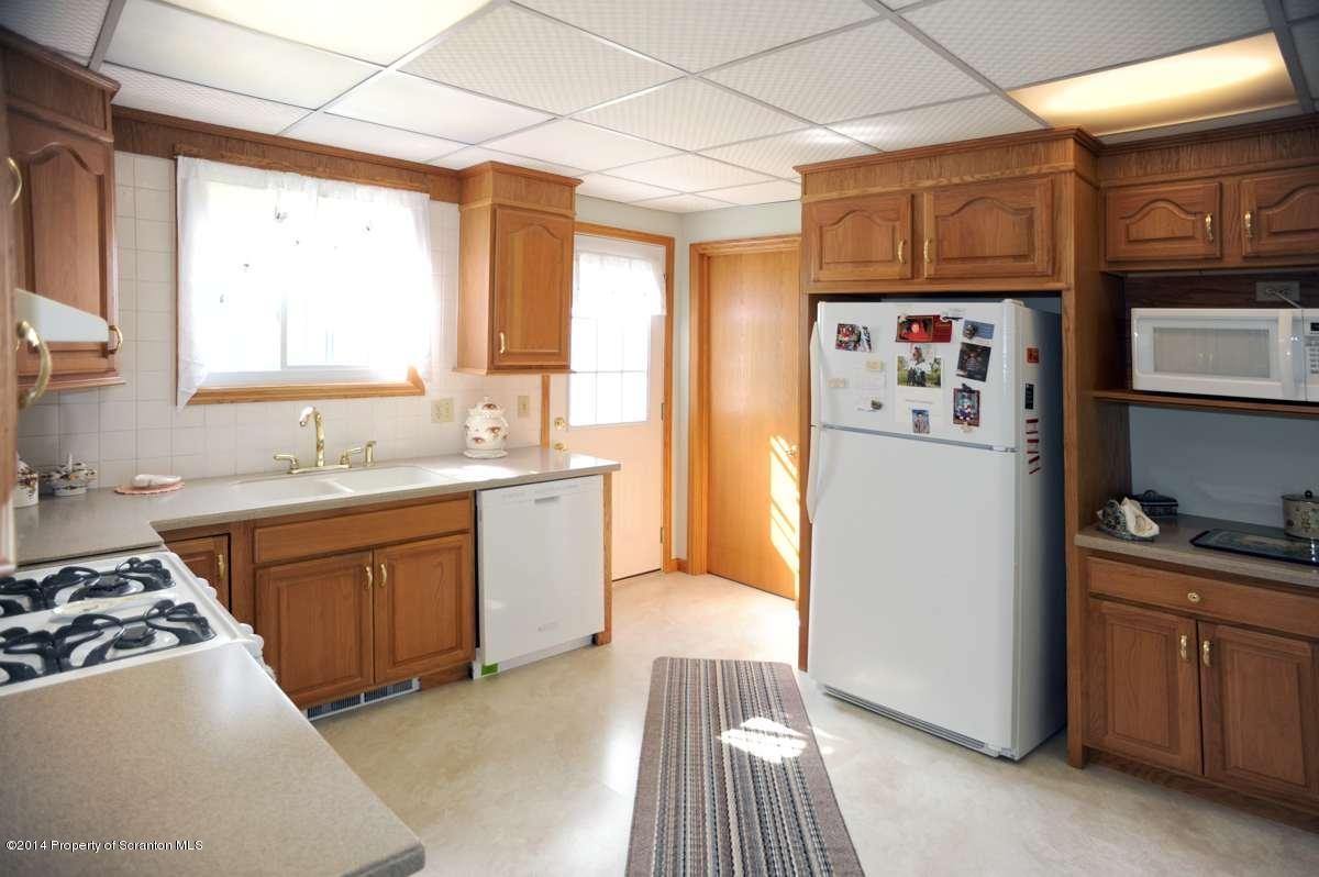 365 State Rte 2035 Nicholson, PA 18446 - Photo 3 of 28 a kitchen with stainless steel appliances granite countertop a refrigerator and a stove